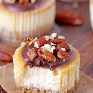 Turtle Mini Cheesecakes – graham cracker crust, creamy cheesecake, turtle topping made of caramel sauce, chocolate and pecans make these rich mini cheesecakes simply irresistible. They’re perfect for holidays and special events.