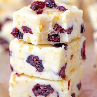 This homemade Cranberry Orange Fudge made with white chocolate, sweetened condensed milk, dried cranberries, orange zest and orange extract is a quick and easy recipe you have to try for Christmas 2023.