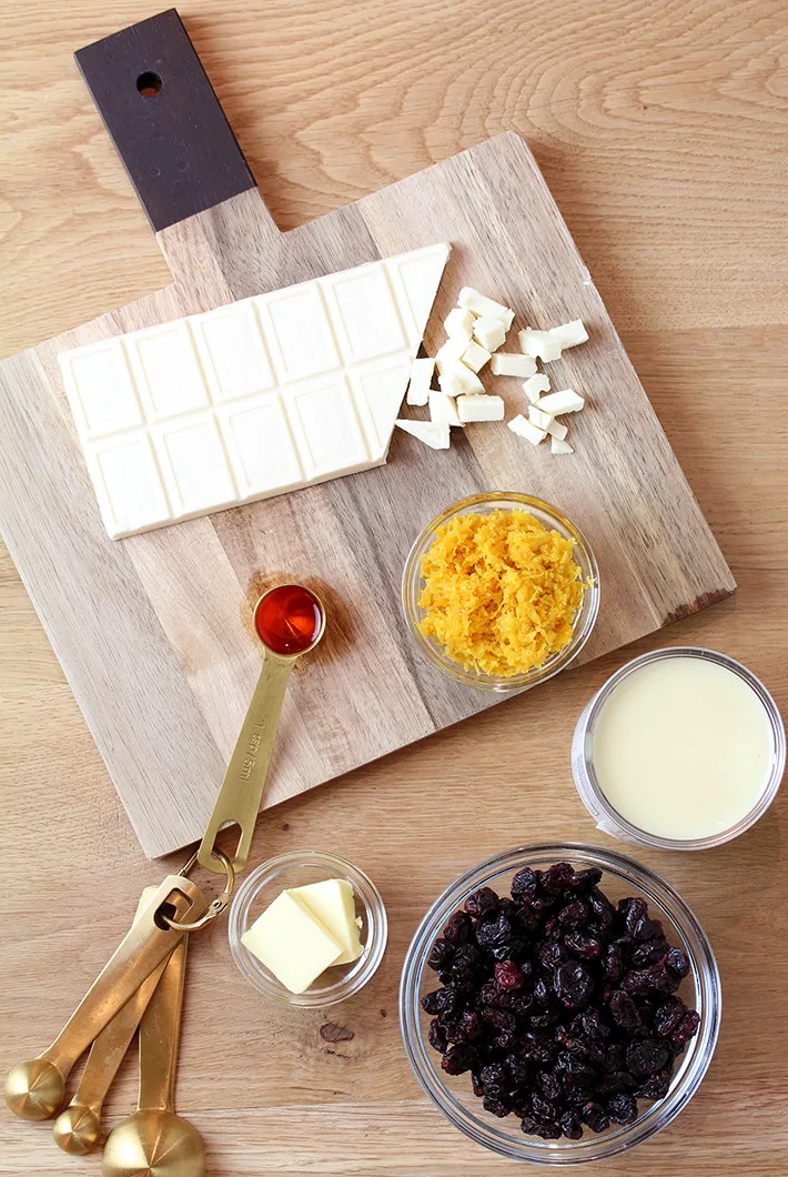 Let’s start with the ingredients that are necessary to make this amazing treat. White chocolate - provides a rich taste and creamy texture. Sweetened condensed milk - gives extra sweetness, smooth texture and helps the ingredients integrate. Unsalted butter- for richer taste and finer texture. Dried cranberries - provide sour sweet taste and chewy chunks in a cream fudge. Grated orange zest gives a spicy aroma. Orange extract is used for extra aroma, as an enhancer.