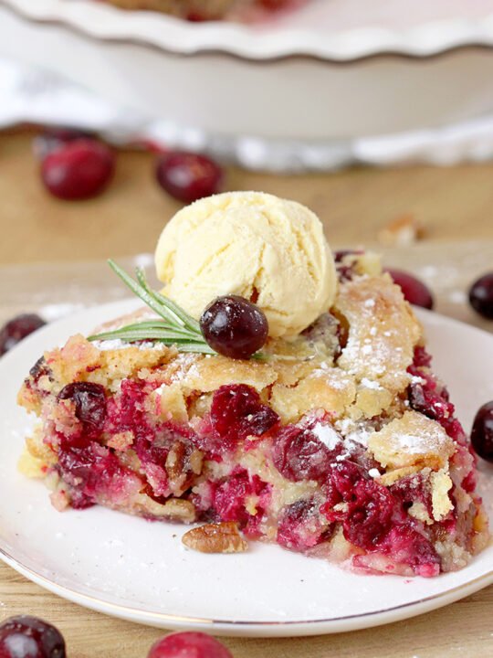Nantucket Holiday Cranberry Pie – juicy cranberry filling with crunchy pecans and a flaky cake layer on top – in one word perfection! Serve warm with a scoop of vanilla ice cream or whipped topping and you’ll enjoy every bite of it.