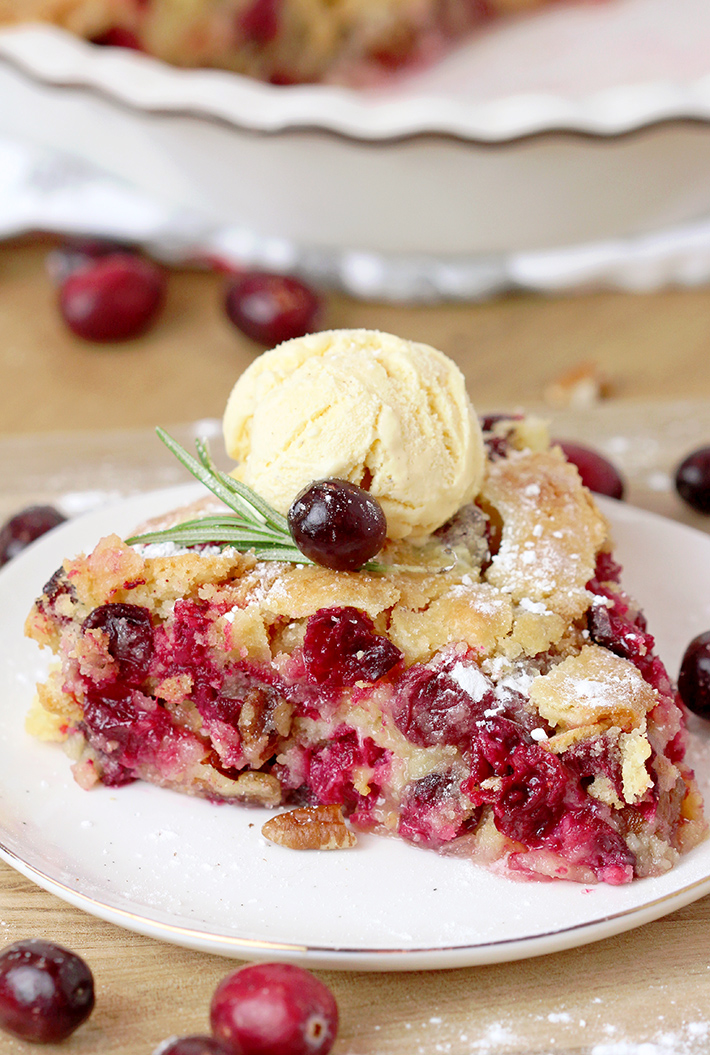 Nantucket Holiday Cranberry Pie – juicy cranberry filling with crunchy pecans and a flaky cake layer on top – in one word perfection! Serve warm with a scoop of vanilla ice cream or whipped topping and you’ll enjoy every bite of it.