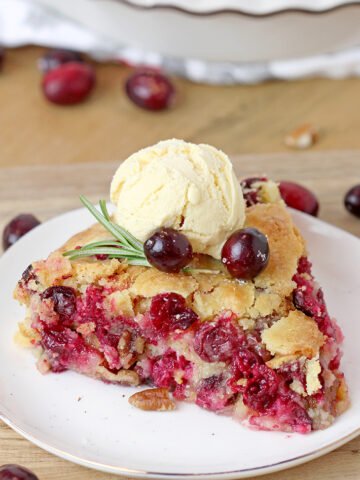 Nantucket Holiday Cranberry Pie – juicy cranberry filling with crunchy pecans and a flaky cake layer on top – in one word perfection! Serve warm with a scoop of vanilla ice cream or whipped topping and you’ll enjoy every bite of it.