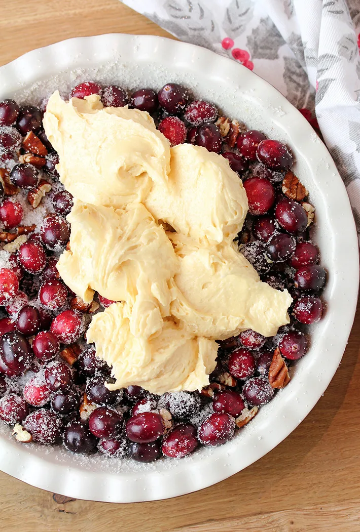 Nantucket Holiday Cranberry Pie – juicy cranberry filling with crunchy pecans and a flaky cake layer on top – in one word perfection! Serve warm with a scoop of vanilla ice cream or whipped topping and you’ll enjoy every bite of it. 