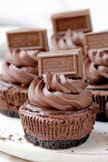 These No Bake Chocolate Mini Cheesecakes are dessert perfect for any occasion, especially holidays. There is chocolate in the crust, cheesecake, ganache and topping – these mini cheesecakes are all made of chocolate! Crunchy Oreo crust, decadent creamy, smooth cheesecake filling, chocolate ganache and fluffy chocolate whipped cream – in one word – perfection.