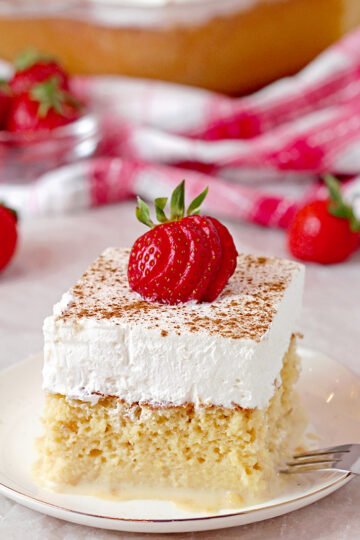 This light and airy sponge cake soaked in three milks, topped with fluffy whipped cream, cinnamon and strawberries is the juiciest cake you’ll ever taste. This popular Mexican cake got its name from Spanish Tres Leches Cake, meaning Three ‘Milks’ Cake.