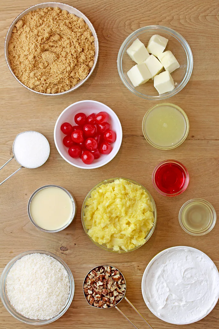 Millionaire pie - this super quick and easy, old fashioned grandma’s recipe with rich, tropical taste can be served for potluck, parties or holidays and it’ll surely be a hit!  This decadent and delicious pie with rich creamy filling made with condensed milk and whipped topping, loaded with pineapple, coconut, pecans and maraschino cherries, on graham cracker crust has a divine taste. 