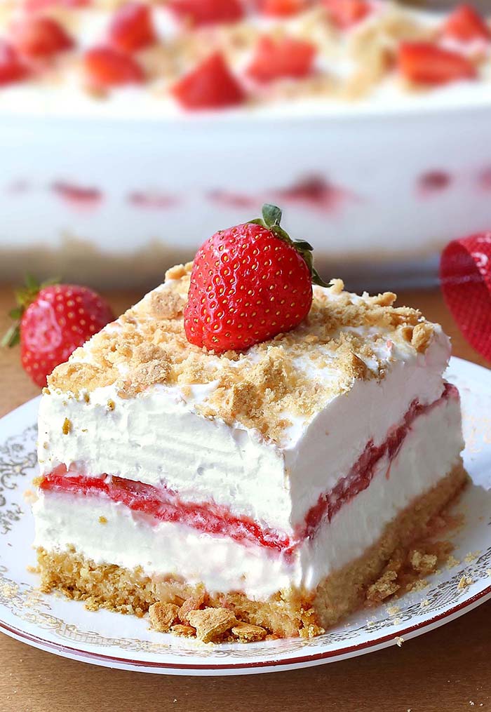 No Bake Strawberry Cheesecake Lasagna will make all Your Strawberries and Cream dreams come true. This is your ticket to becoming a backyard-barbecue legend, perfect for 4th of July or any other family get-togethers.