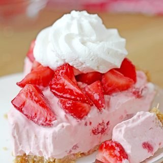 This Strawberry Cheesecake is an easy cake with cream cheese and whipped cream, filled with strawberry sauce on graham cracker crust, topped with fresh, juicy strawberries and whipped topping. I love preparing no bake dessert recipes, it takes less time to make them and I don’t have to turn the oven on - perfect for warm days. 