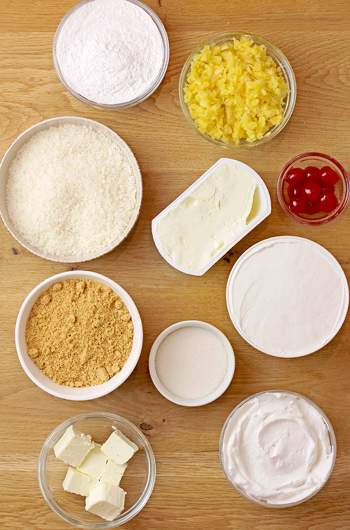 Which ingredients are necessary to make Pineapple Cream Pie:Graham cracker crumbs,
unsalted butter,
granulated sugar,
full fat cream cheese,
powdered sugar,
crushed pineapple,
shredded coconut,
cool whip,
whipped topping,
maraschino cherries.