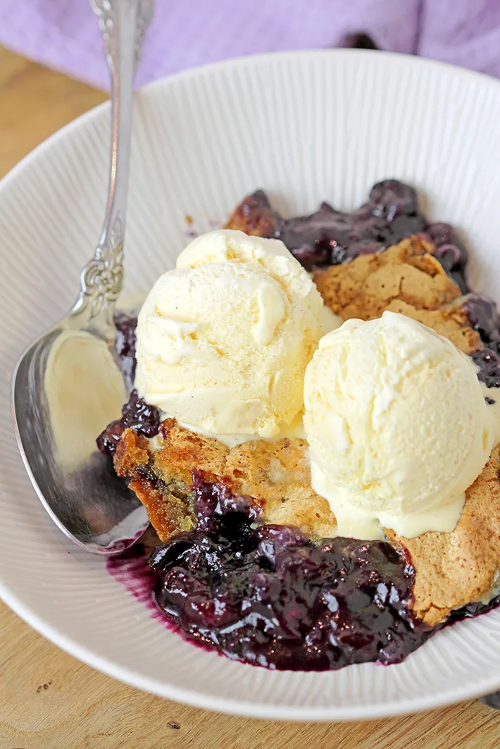 This old fashioned Blueberry Cobbler is the easiest recipe for the tastiest dessert from ingredients you already have on hand, it’s simply perfect. Sweet, juicy blueberries coated with crunchy buttery batter are best served warm with a scoop of vanilla ice cream.  