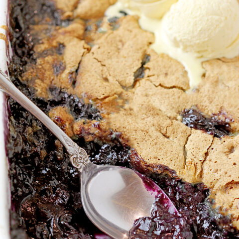 This old fashioned Blueberry Cobbler is the easiest recipe for the tastiest dessert from ingredients you already have on hand, it’s simply perfect. Sweet, juicy blueberries coated with crunchy buttery batter are best served warm with a scoop of vanilla ice cream. 