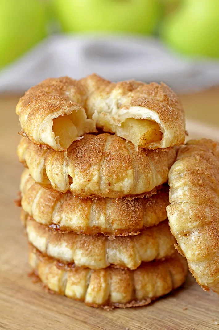 These Puff Pastry Apple Cinnamon Rings are a light treat made with only a few ingredients and it's perfect for the upcoming fall days. You will love juicy apples with cinnamon in a flaky puff pastry at first bite. They taste like apple pie and yet, they’re so different. These lovely rings are a must make fall treat. 