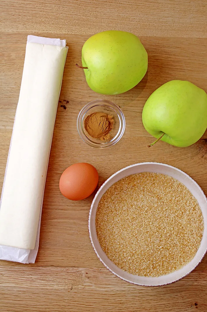 These Puff Pastry Apple Cinnamon Rings are a light treat made with only a few ingredients and it's perfect for the upcoming fall days. You will love juicy apples with cinnamon in a flaky puff pastry at first bite. They taste like apple pie and yet, they’re so different. These lovely rings are a must make fall treat.