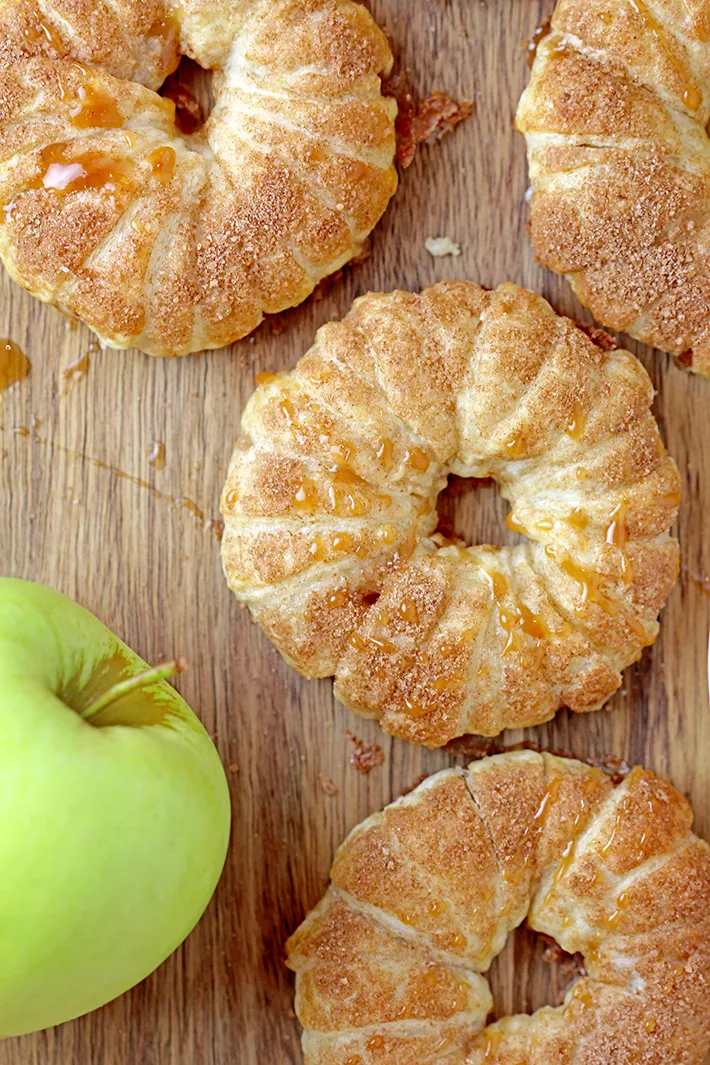 These Puff Pastry Apple Cinnamon Rings are a light treat made with only a few ingredients and it's perfect for the upcoming fall days. You will love juicy apples with cinnamon in a flaky puff pastry at first bite. They taste like apple pie and yet, they’re so different. These lovely rings are a must make fall treat. 