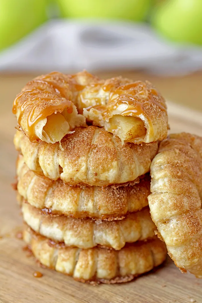 These Puff Pastry Apple Cinnamon Rings are a light treat made with only a few ingredients and it's perfect for the upcoming fall days. You will love juicy apples with cinnamon in a flaky puff pastry at first bite. They taste like apple pie and yet, they’re so different. These lovely rings are a must make fall treat. 