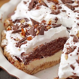 Arkansas Possum Pie - this easy southern pie with 4 layers is perfect for upcoming holidays. Prepare it for Thanksgiving and you’ll be pleasantly surprised.. Buttery pecan shortbread crust, cream cheese layer, decadent chocolate pudding layer topped with fluffy whipped cream, some more chocolate and pecans, in one word - perfection!