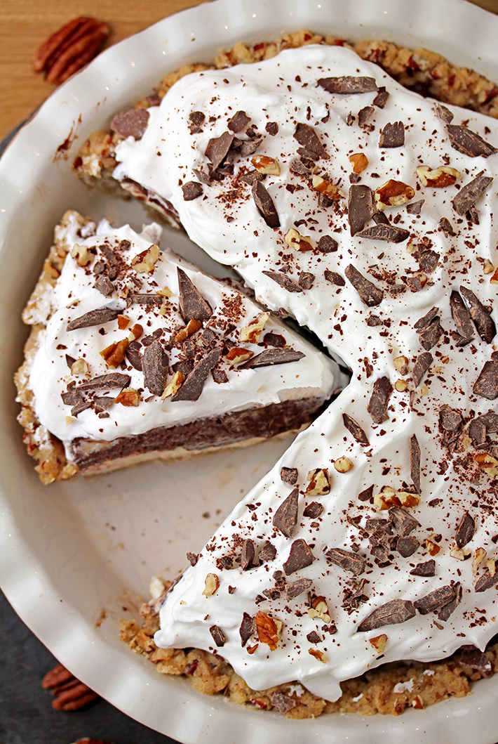 Arkansas Possum Pie - this easy southern pie with 4 layers is perfect for upcoming holidays. Prepare it for Thanksgiving and you’ll be pleasantly surprised.. Buttery pecan shortbread crust, cream cheese layer, decadent chocolate pudding layer topped with fluffy whipped cream, some more chocolate and pecans, in one word - perfection!