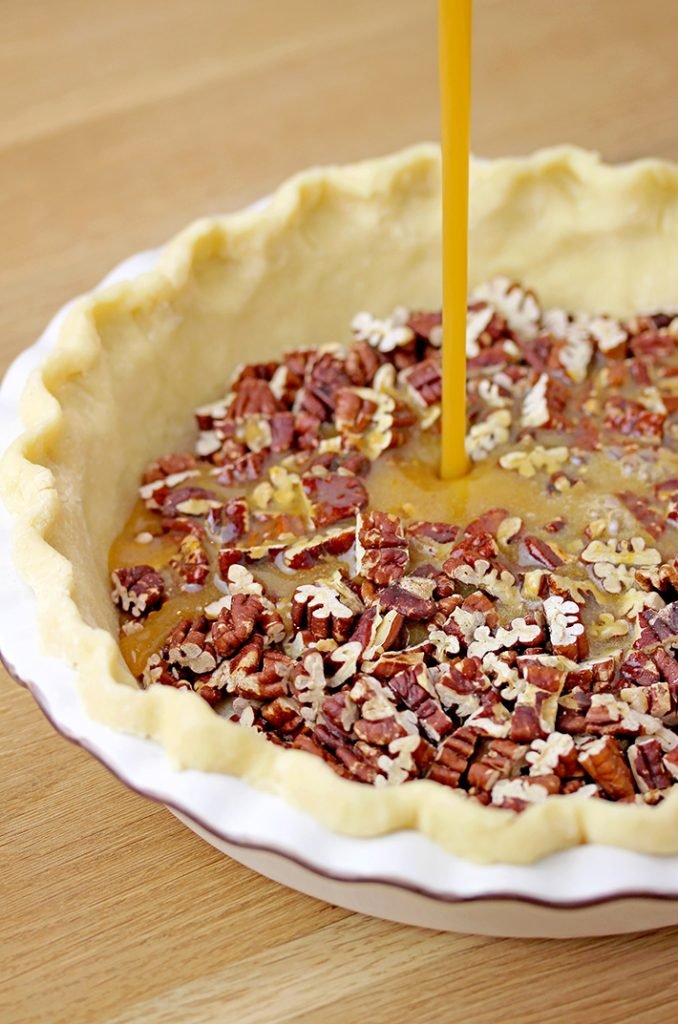 Easy Maple Honey Pecan Pie – flaky, buttery crust, gooey maple honey brown butter filling, crunchy toasted pecans mmmm this pie has to be made for Thanksgiving.