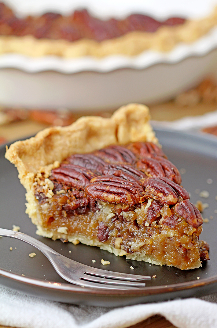 Easy Maple Honey Pecan Pie - flaky, buttery crust, gooey maple honey brown butter filling, crunchy toasted pecans mmmm this pie has to be made for Thanksgiving.