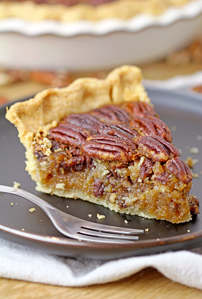 Easy Maple Honey Pecan Pie - flaky, buttery crust, gooey maple honey brown butter filling, crunchy toasted pecans mmmm this pie has to be made for Thanksgiving.