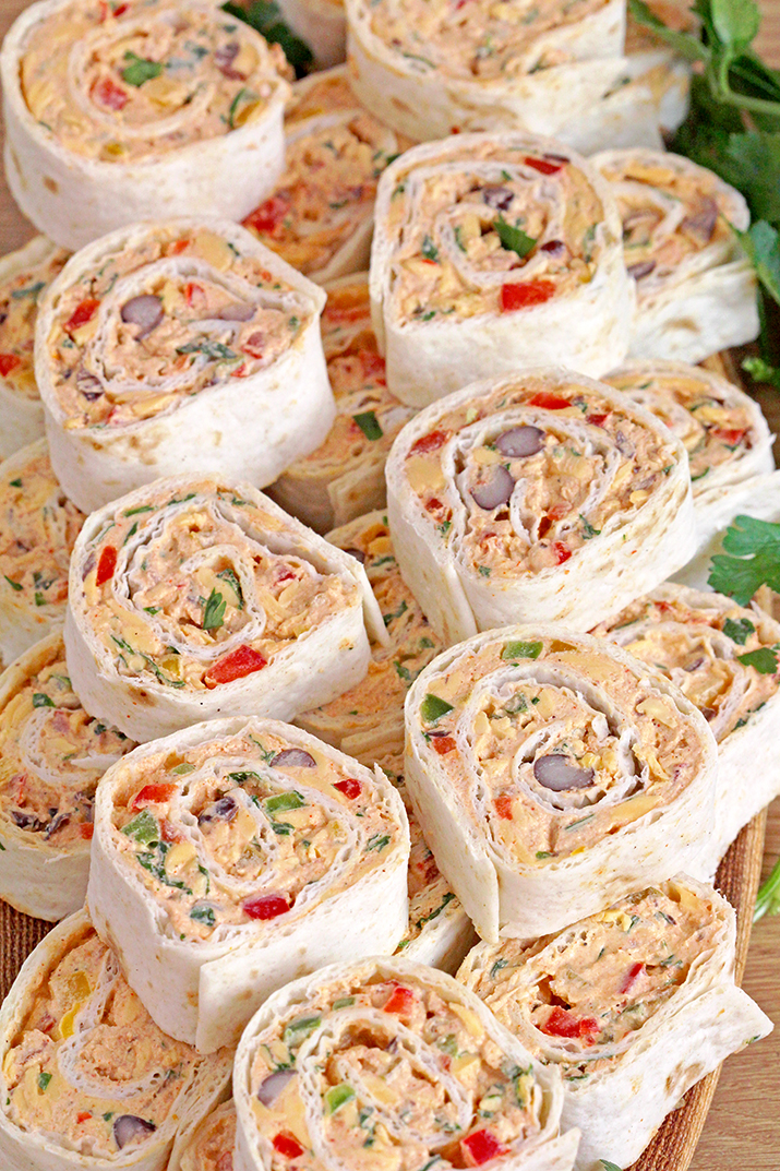 These Mexican Tortilla Roll Ups are the ultimate party appetizer that are quick and easy to make, and they'll win you over with their flavor. These tasty bites are the number 1 finger food for gatherings, parties, celebrations, and holidays. Make these Mexican Tortilla Roll Ups for Game Day, and you'll enjoy every moment.