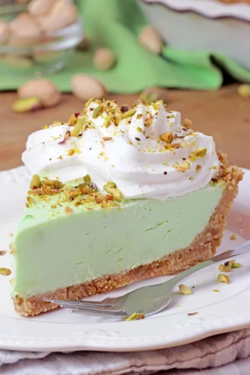 Pistachio Cream Pie is an easy, quick, no - bake dessert with a crunchy graham cracker crust, a creamy filling made with pistachio pudding, cream cheese, and heavy whipping cream, topped with whipped topping and chopped pistachios