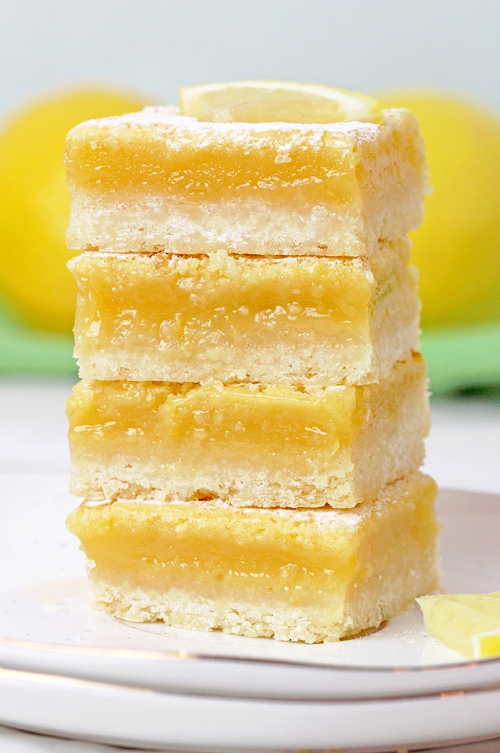 Looking for the Easiest lemon bars recipe? These homemade lemon bars with a buttery shortbread crust and tangy lemon filling are the ultimate lemon dessert.