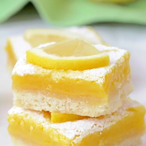 Looking for the perfect Easy lemon bars recipe? These homemade lemon bars with a buttery shortbread crust and tangy lemon filling are the ultimate lemon dessert.