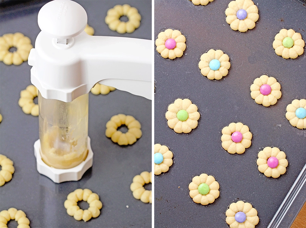 Use an ungreased, unlined baking sheet. Avoid parchment paper, as the cookies need to stick slightly to the sheet when being pressed out. Don't overmix the butter and sugar. Too much air in the dough will cause the cookies to spread and flatten during baking. Mixing for 1-2 minutes is enough. Avoid overly softened butter. The butter should be just soft enough to mix—this helps the cookies maintain their shape and thickness. For thicker cookies, chill the dough in the fridge for 10-15 minutes before pressing. Also, chill the baking sheet before using. To ensure the M&Ms stick, press them onto the cookies immediately after taking them out of the oven. Work quickly, as the cookies set fast.