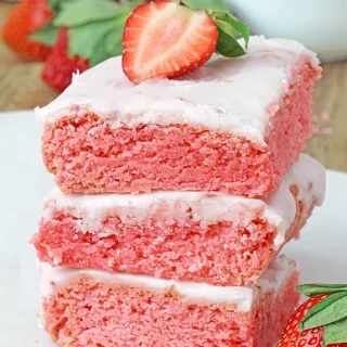 Super Easy Strawberry Brownies - these super moist and easy strawberry brownies are made with strawberry cake mix and a few simple ingredients, topped with a sweet frosting made from strawberry preserves. They're incredibly delicious and unbelievably easy to make - the perfect last minute dessert. 