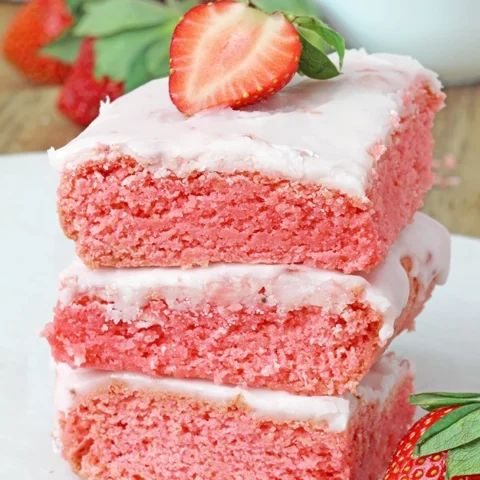 Super Easy Strawberry Brownies - these super moist and easy strawberry brownies are made with strawberry cake mix and a few simple ingredients, topped with a sweet frosting made from strawberry preserves. They're incredibly delicious and unbelievably easy to make - the perfect last minute dessert.