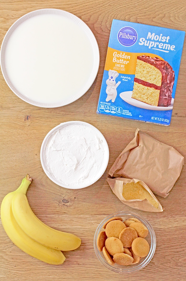Banana Pudding Poke Cake – quick and easy, moist and soft, made with yellow cake mix, filled with banana pudding, topped with whipped topping, banana slices, and crushed Nilla Wafers. Try this simple and creamy Banana Pudding Poke Cake – a perfect combination of cake, banana pudding, and whipped cream!