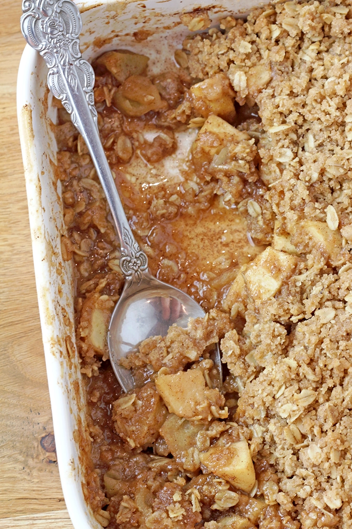 These Apple Crisp Tacos are the ultimate fall dessert, made with crispy cinnamon - sugar tortilla shells filled with apple crisp, topped with whipped topping or ice cream and drizzled with caramel sauce. They are perfect for gatherings, parties, picnics or even holidays.