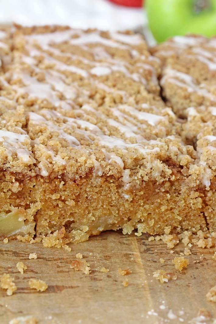 Apple Crumb Cake is a soft, moist cake filled with juicy apples and topped with an extra brown sugar cinnamon crumb topping. This perfect fall dessert holds a special place in my cookbook!