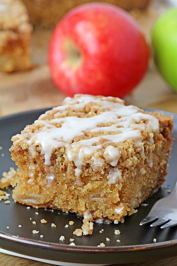 Apple Crumb Cake is a soft, moist cake filled with juicy apples and topped with an extra brown sugar cinnamon crumb topping. This perfect fall dessert holds a special place in my cookbook!