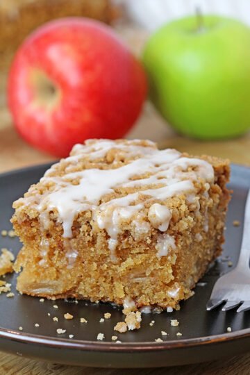 Apple Crumb Cake is a soft, moist cake filled with juicy apples and topped with an extra brown sugar cinnamon crumb topping. This perfect fall dessert holds a special place in my cookbook!