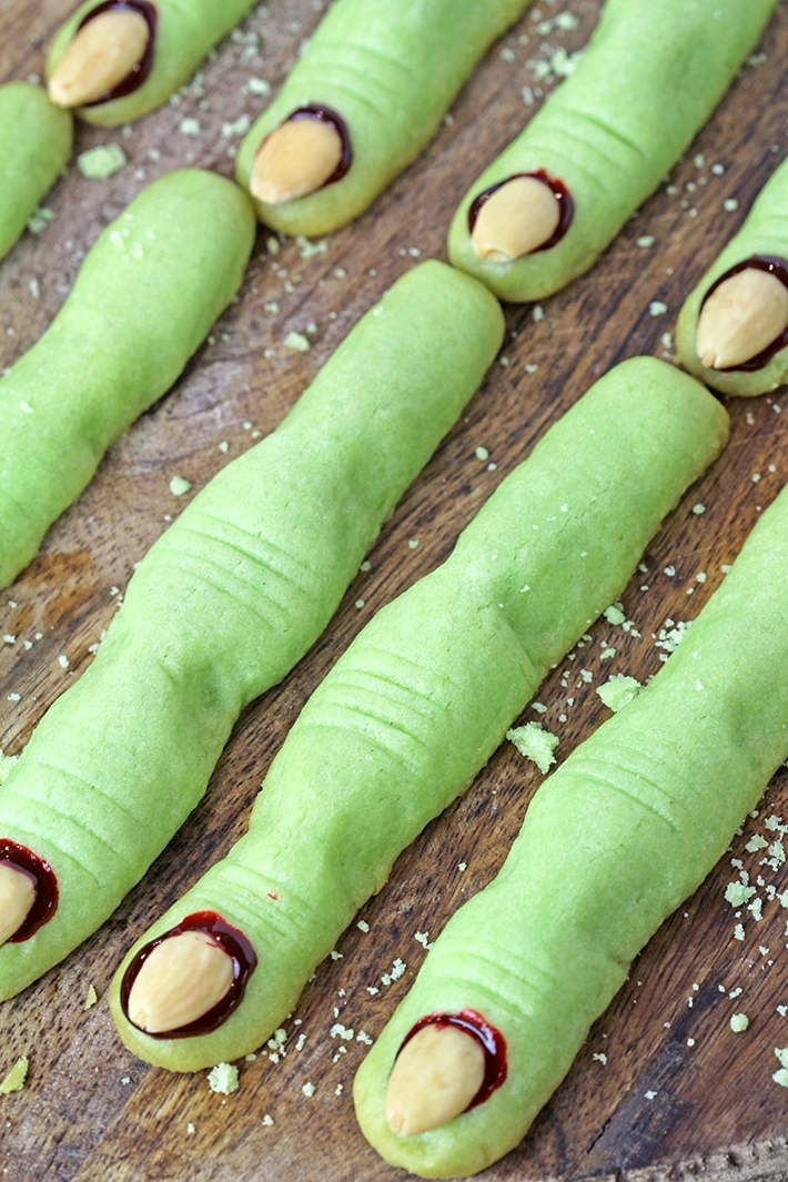 Decorating spooky Witch Finger Cookies for Halloween party