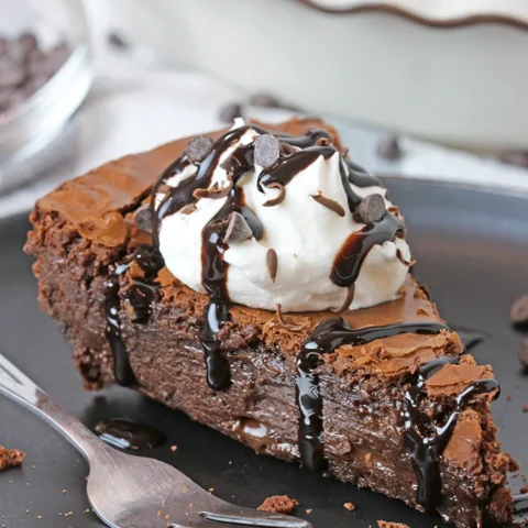 Gooey Chocolate Brownie Pie is one of the most delicious and easiest pies I have ever made. Fudgy texture and crackly top - simply perfection! It is a family favorite so we often prepare it and always enjoy its rich taste. It is typically served with whipped topping or a scoop of vanilla ice cream and drizzled with hot fudge sauce.