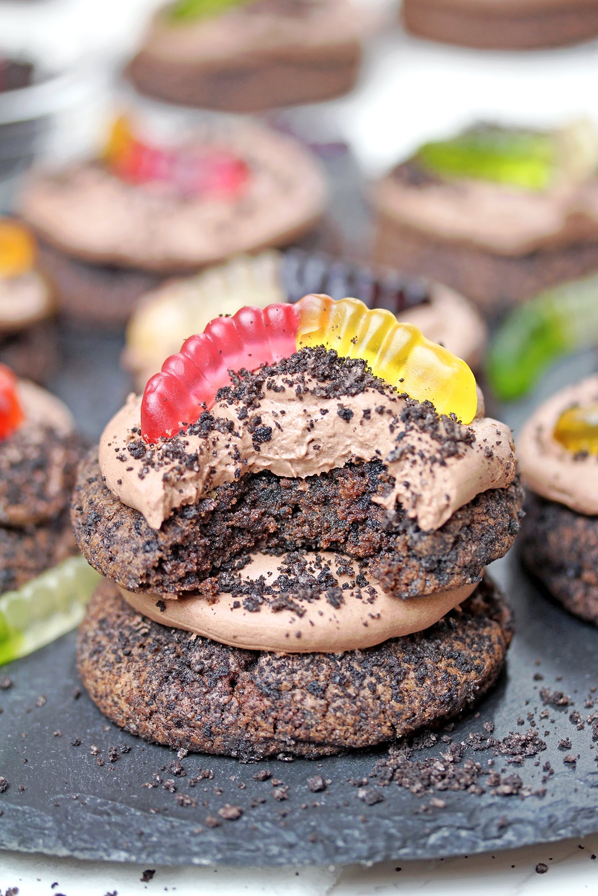 Dirt Cake Cookie with a bite showing its soft, chewy texture..