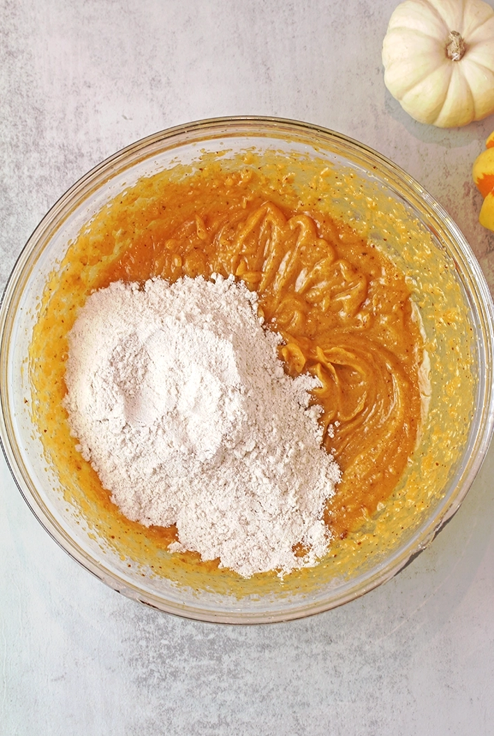Step 3: Mix the wet ingredients. First, whisk together the browned butter, brown sugar, and granulated sugar. Then add the pumpkin purée, egg yolks, and vanilla extract.