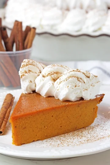 This Easy Crustless Pumpkin Pie is a perfect Thanksgiving recipe that can be prepared in just a few minutes! No crust, fewer calories, and a total time-saver! Quick and simple, rich in flavor, creamy, and silky-smooth — this pie is the perfect choice for a fall dessert.
