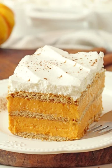 This quick and easy No-bake Pumpkin Eclair Cake, made with layers of graham crackers and rich layers of pumpkin filling , topped with whipped topping, is the perfect fall dessert! Ready in only 10 minutes plus chill time, it’s great for gatherings and holidays - especially Thanksgiving.