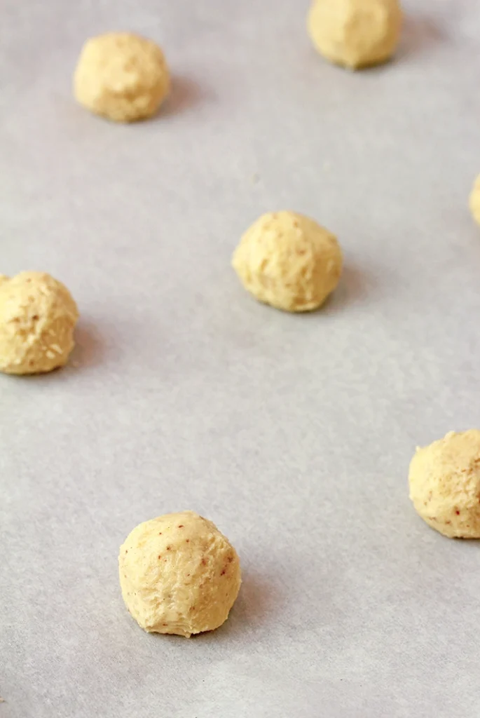 Holiday Snowball Cookies — these buttery, melt-in-your-mouth classics made with just 5 ingredients are perfect for Christmas. They’re soft, slightly crumbly, and rolled in a fine layer of powdered sugar, just like real snowballs that melt in your mouth!