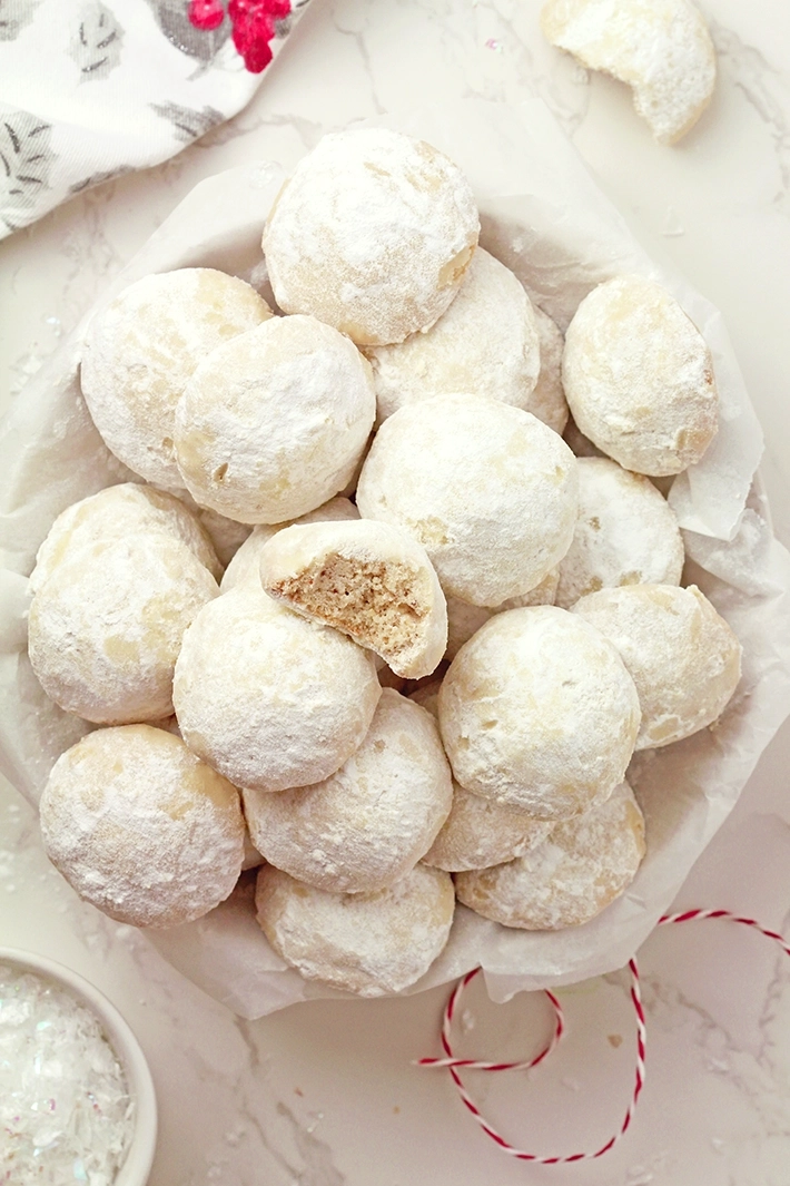 Holiday Snowball Cookies — these buttery, melt-in-your-mouth classics made with just 5 ingredients are perfect for Christmas. They’re soft, slightly crumbly, and rolled in a fine layer of powdered sugar, just like real snowballs that melt in your mouth!