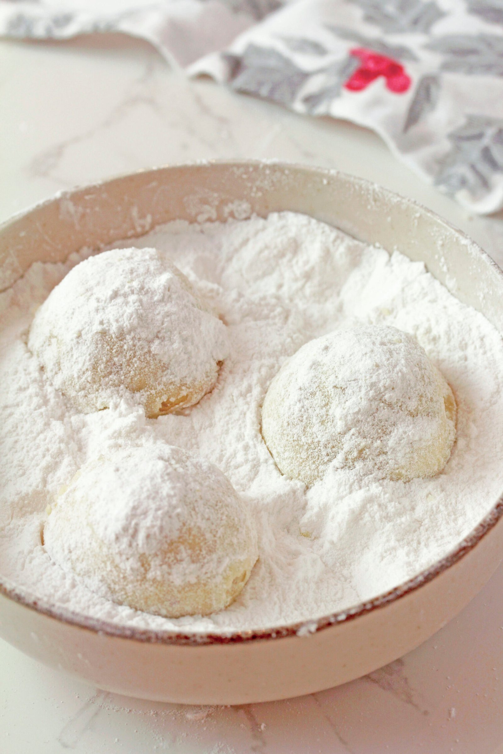 Holiday Snowball Cookies — these buttery, melt-in-your-mouth classics made with just 5 ingredients are perfect for Christmas. They’re soft, slightly crumbly, and rolled in a fine layer of powdered sugar, just like real snowballs that melt in your mouth!