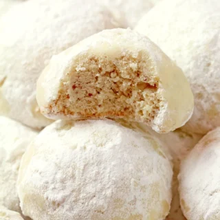 Holiday Snowball Cookies — these buttery, melt-in-your-mouth classics made with just 5 ingredients are perfect for Christmas. They’re soft, slightly crumbly, and rolled in a fine layer of powdered sugar, just like real snowballs that melt in your mouth!