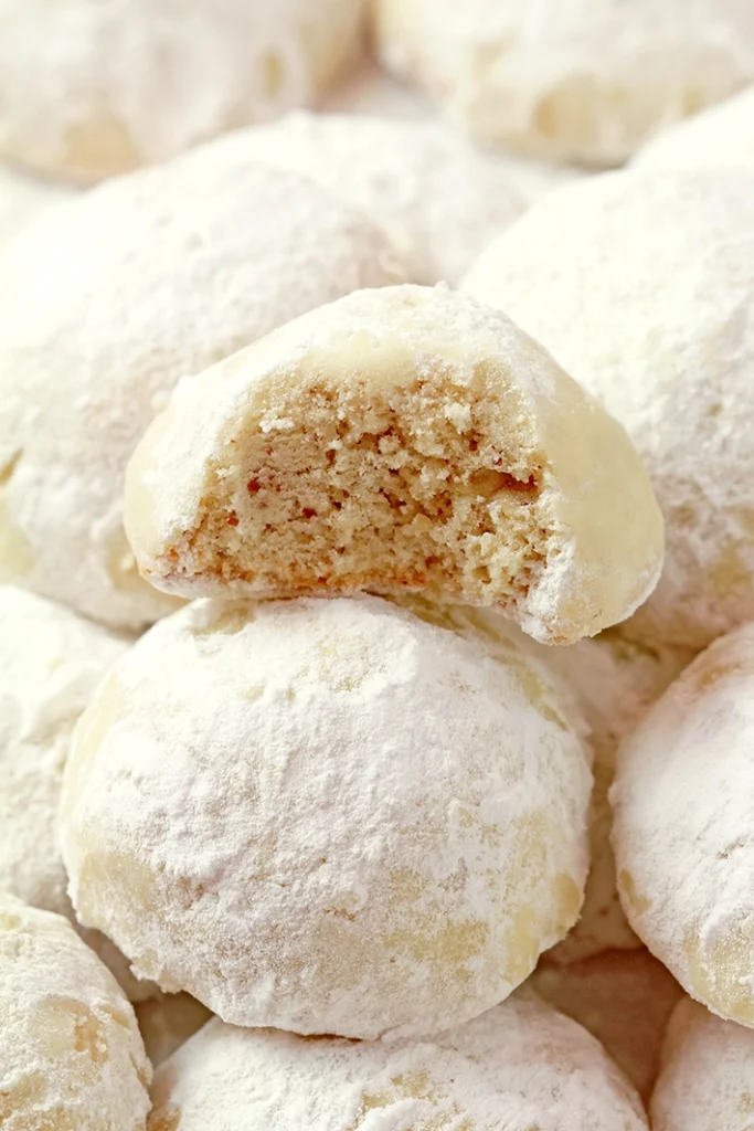 Holiday Snowball Cookies — these buttery, melt-in-your-mouth classics made with just 5 ingredients are perfect for Christmas. They’re soft, slightly crumbly, and rolled in a fine layer of powdered sugar, just like real snowballs that melt in your mouth!