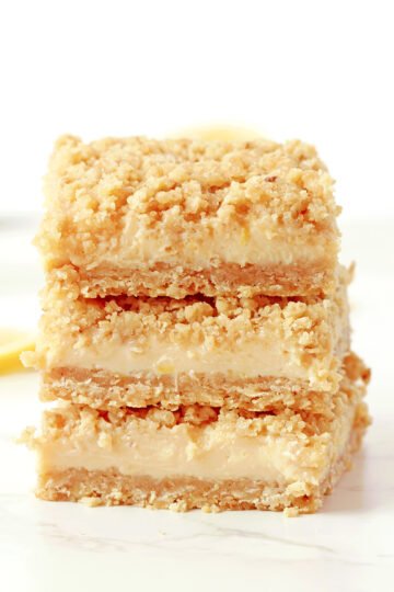 These Easy Lemon Crumb Bars have a buttery oat shortbread crust, a creamy fresh lemon filling made with sweetened condensed milk, and a rich crumb topping that bakes up golden and crisp. They're the ultimate easy lemon dessert for spring and summer - perfect for Easter, Mother's Day, BBQs, potlucks, or anytime you're craving something bright and refreshing.