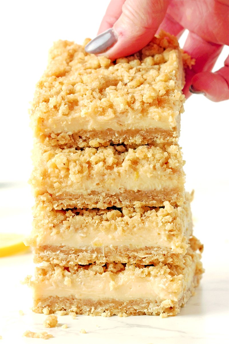 These Easy Lemon Crumb Bars have a buttery oat shortbread crust, a creamy fresh lemon filling made with sweetened condensed milk, and a rich crumb topping that bakes up golden and crisp. They’re the ultimate easy lemon dessert for spring and summer — perfect for Easter, Mother’s Day, BBQs, potlucks, or anytime you’re craving something bright and refreshing.