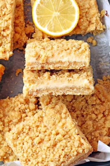 These Easy Lemon Crumb Bars have a buttery oat shortbread crust, a creamy fresh lemon filling made with sweetened condensed milk, and a rich crumb topping that bakes up golden and crisp. They're the ultimate easy lemon dessert for spring and summer - perfect for Easter, Mother's Day, BBQs, potlucks, or anytime you're craving something bright and refreshing.